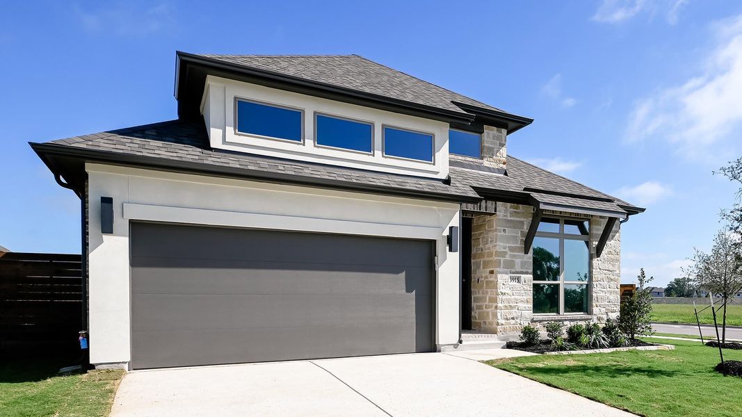 Front exterior of a new home in Juniper Springs, Lockhart, TX, highlighting curb appeal (Image 18). Front exterior of a new home in Juniper Springs, Lockhart, TX, highlighting curb appeal (Image 18).