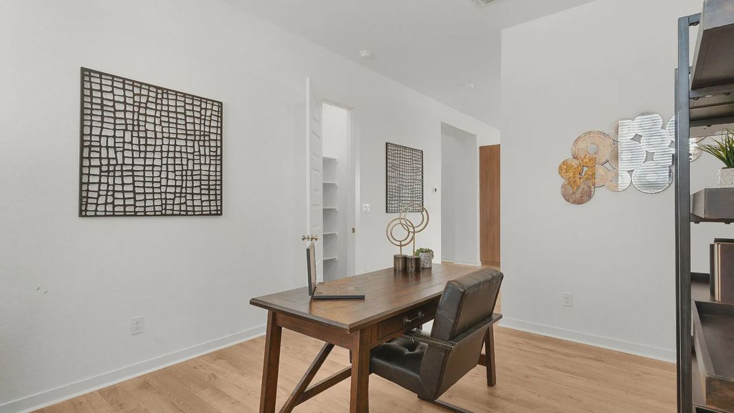 Representative furnished interior of a home built from the Lauren by Chesmar Homes in University Heights, Round Rock (Image 7).