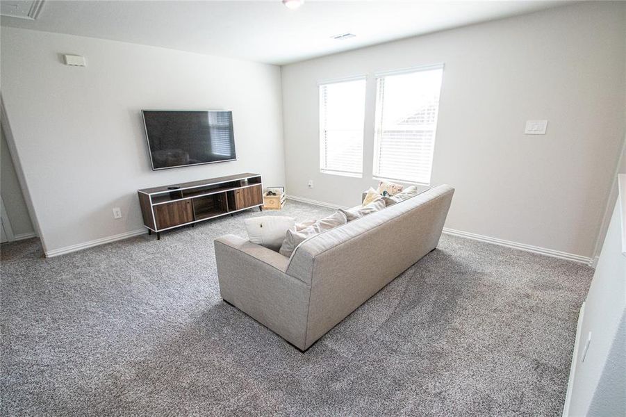 Living room featuring carpet Living room featuring carpet