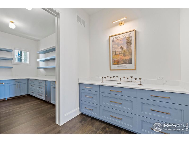 Motion sensor equipped Butlers Pantry with quartz countertops, and massive storage