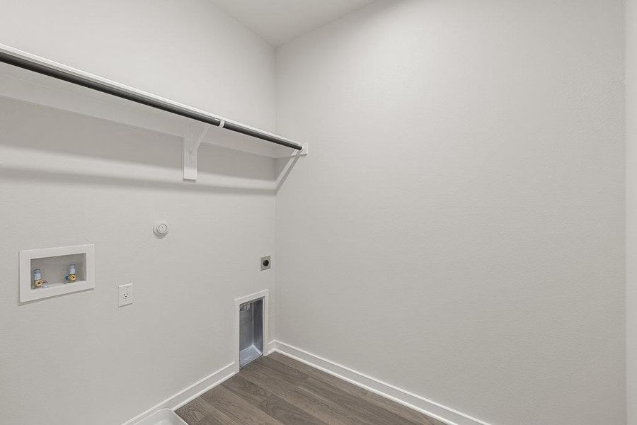 Laundry room featuring hookup for a gas dryer, dark wood-style floors, hookup for an electric dryer, and hookup for a washing machine