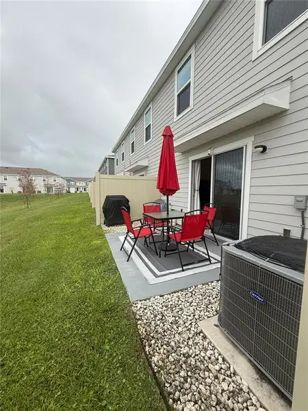 Exterior details and patio area of a home in The Towns at Laurel Commons, Ocala (Image 4).