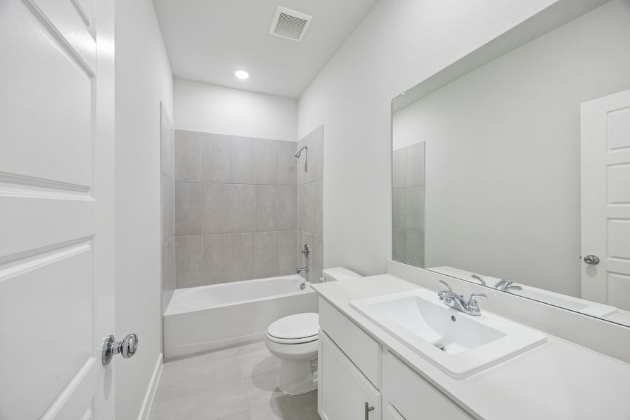 Secondary Bathroom in the Birch home plan by Trophy Signature Homes – REPRESENTATIVE PHOTO