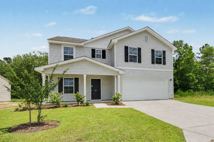 Front exterior of a new home in Cottonwood Place, Tabor City, NC, highlighting curb appeal (Image 1). Front exterior of a new home in Cottonwood Place, Tabor City, NC, highlighting curb appeal (Image 1).