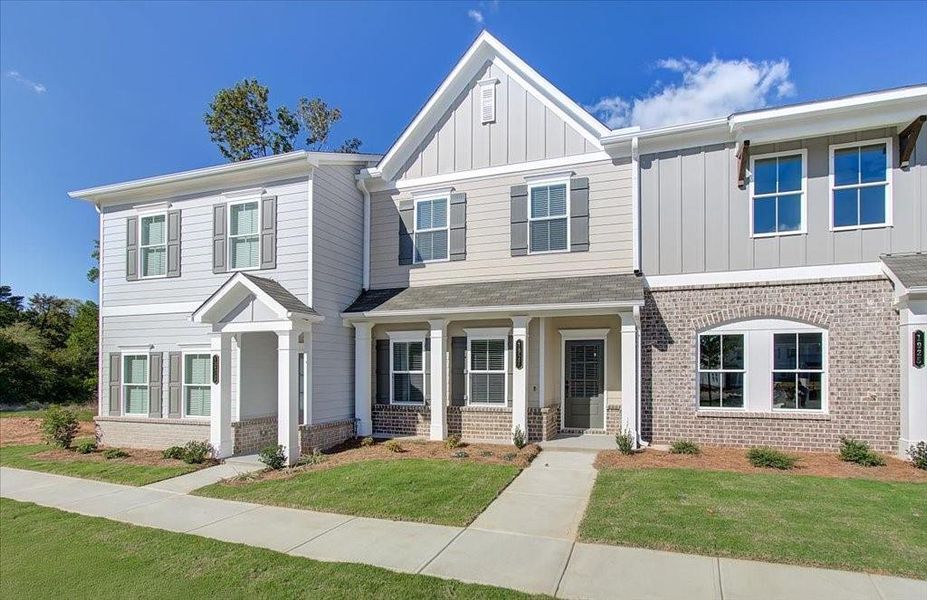 Front exterior of a new home in East Park Village, Kennesaw, GA, highlighting curb appeal (Image 1). Front exterior of a new home in East Park Village, Kennesaw, GA, highlighting curb appeal (Image 1).