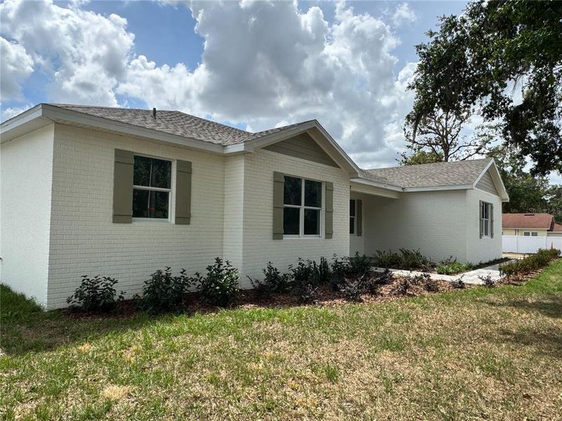 Front exterior of a new home in , Dade City, FL, highlighting curb appeal (Image 22).