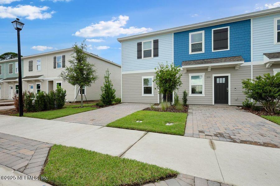 Front exterior of a new home in Sabal Terrace, Jacksonville, FL, highlighting curb appeal (Image 21).