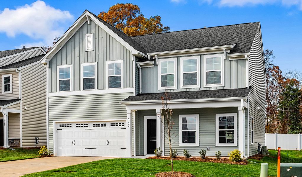 Front exterior of a new home in Hanes Lake, Winston-Salem, NC, highlighting curb appeal (Image 21). Front exterior of a new home in Hanes Lake, Winston-Salem, NC, highlighting curb appeal (Image 21).