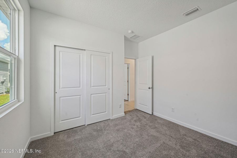 Spacious, unfurnished interior of a new home in Lakes at Bella Lago - Signature Series, Green Cove Springs (Image 30).