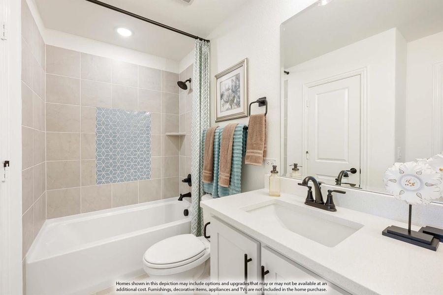 Bathroom with tiled tub-shower combo, white vanity with single sink, and large mirror Bathroom with tiled tub-shower combo, white vanity with single sink, and large mirror