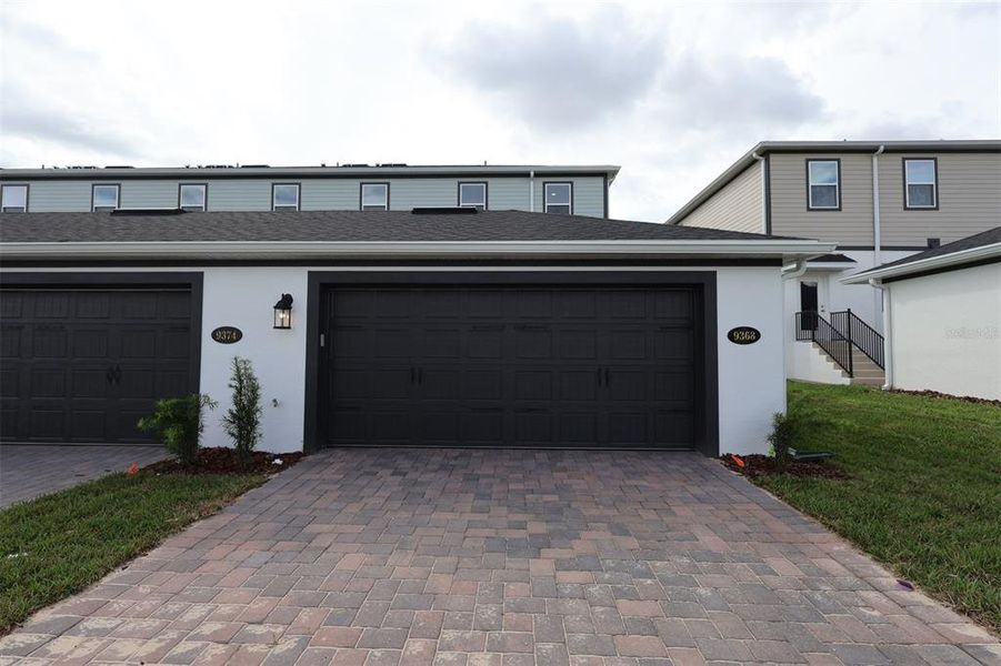 Exterior details and patio area of a home in Tribute at Ovation, Winter Garden (Image 4).