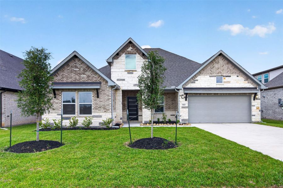Front exterior of a new home in , Alvin, TX, highlighting curb appeal (Image 24).