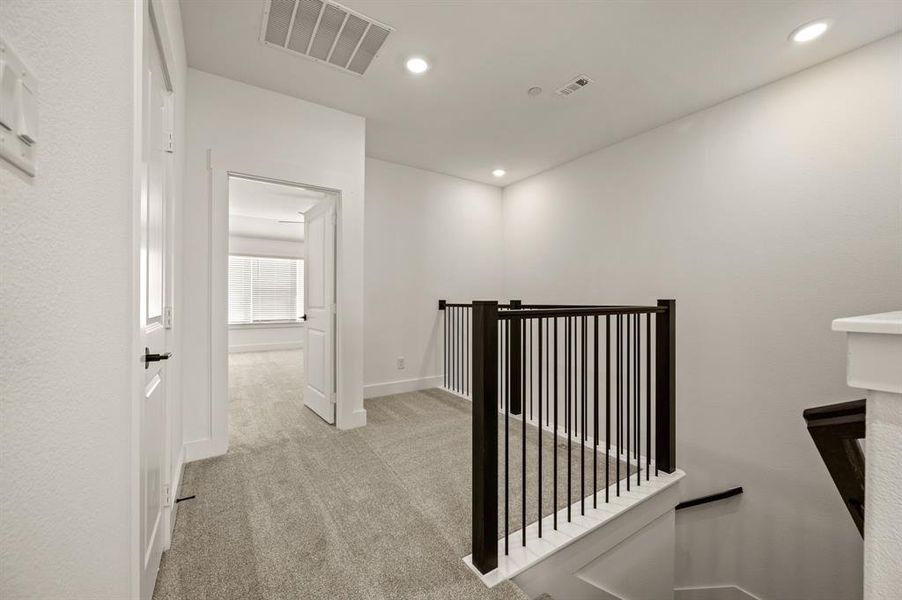 Upstairs offers a nicely sized laundry area and loft that is perfect for a pocket office.