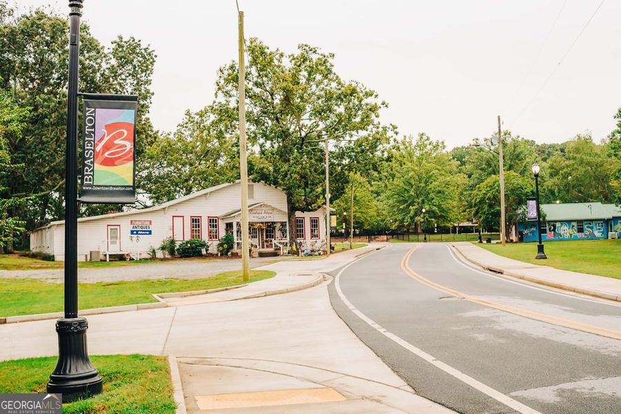 Front exterior of a new home in Rosewood Lake Estates, Hoschton, GA, highlighting curb appeal (Image 39).