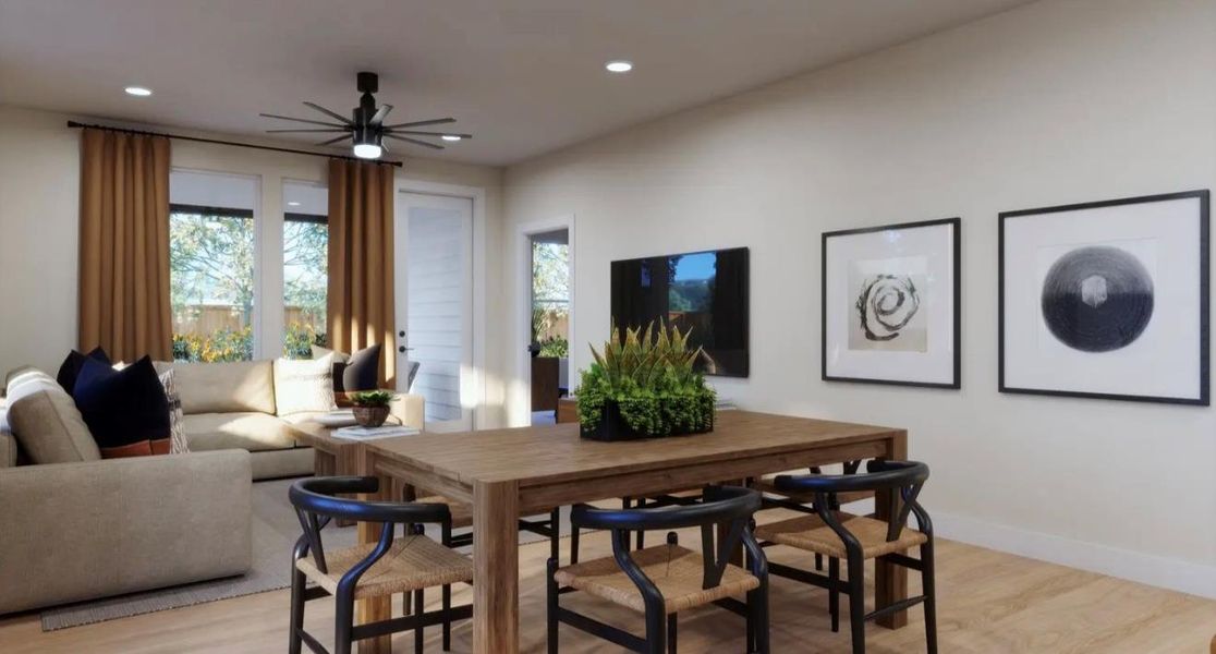 Living area featuring light wood finished floors, a ceiling fan, and recessed lighting