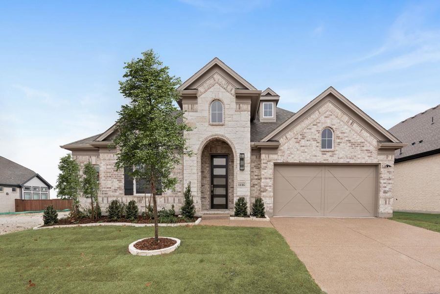Front exterior of a new home in Monterra, Fate, TX, highlighting curb appeal (Image 1). Front exterior of a new home in Monterra, Fate, TX, highlighting curb appeal (Image 1).