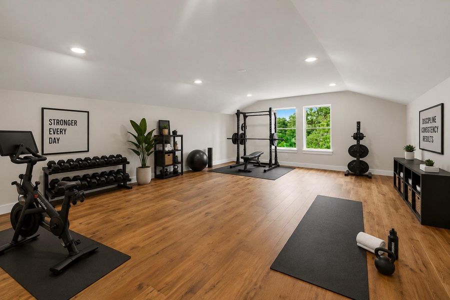 The third floor offers a true flex space - this could be a spacious home fitness studio.  Flooded with natural light and finished with warm wood floors...a man cave, billiards room, giant playroom, the possibilities are endless.  Virtually staged to illustrate furnishing possibilities
