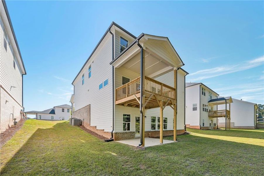 Front exterior of a new home in Martin Springs - Estate Series, Lawrenceville, GA, highlighting curb appeal (Image 2). Front exterior of a new home in Martin Springs - Estate Series, Lawrenceville, GA, highlighting curb appeal (Image 2).