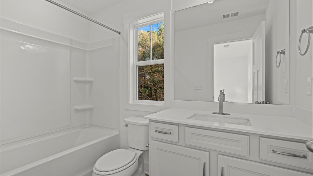 Accomplished full bath designed with both comfort and sophistication in mind