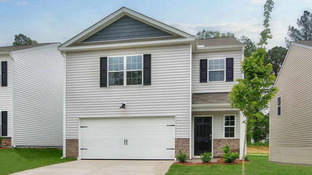 Front exterior of a new home in Laurel Oaks, Sanford, NC, highlighting curb appeal (Image 1). Front exterior of a new home in Laurel Oaks, Sanford, NC, highlighting curb appeal (Image 1).