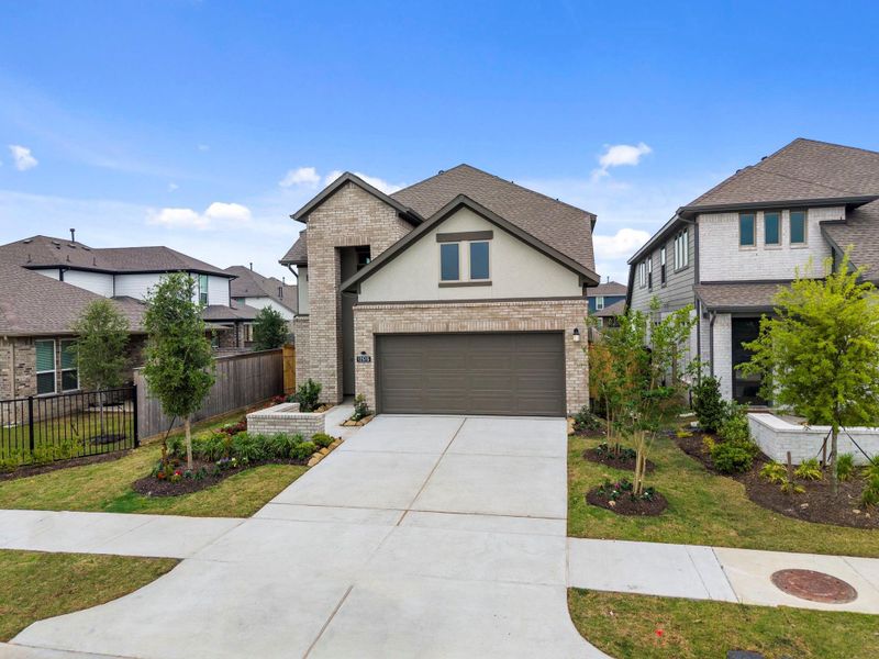Front exterior of a new home in Bridgeland, Cypress, TX, highlighting curb appeal (Image 21).