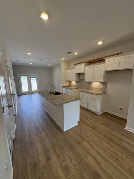 Photo is of the model home to show what the completed floor plan looks like. Selections and Options may vary. ALL STAINLESS STEEL KITCHEN APPLIANCES WILL BE INCLUDED