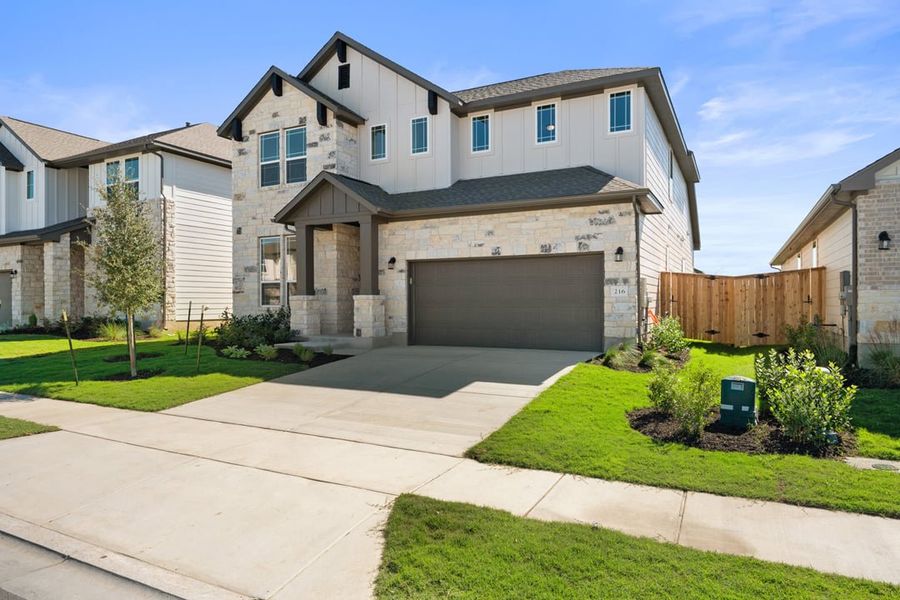 Front exterior of a new home in Park Collection At Park Central, Georgetown, TX, highlighting curb appeal (Image 1). Front exterior of a new home in Park Collection At Park Central, Georgetown, TX, highlighting curb appeal (Image 1).