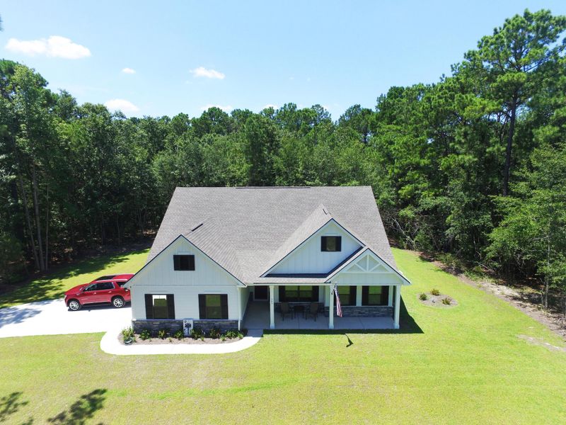 Front exterior of a new home in , Awendaw, SC, highlighting curb appeal (Image 25).