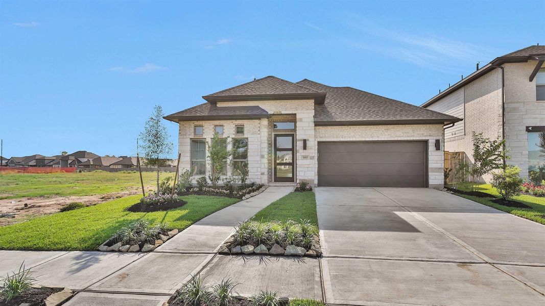Front exterior of a new home in Sienna 50', Missouri City, TX, highlighting curb appeal (Image 16). Front exterior of a new home in Sienna 50', Missouri City, TX, highlighting curb appeal (Image 16).