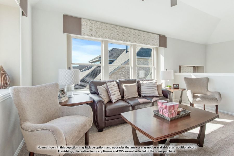 Living room with dark leather sofa, two gray accent chairs, wood coffee table, and large windows with roman shades Living room with dark leather sofa, two gray accent chairs, wood coffee table, and large windows with roman shades