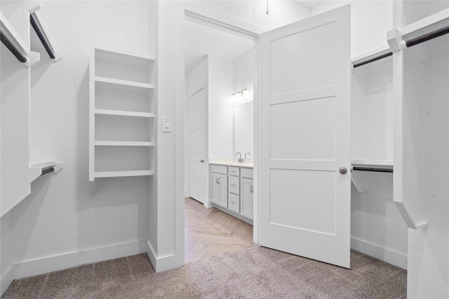 This is an organizer's dream! The immaculate closet features extensive high shelving and multiple tiers of hanging space, ensuring you'll have more than enough room for your entire wardrobe and all of your belongings.