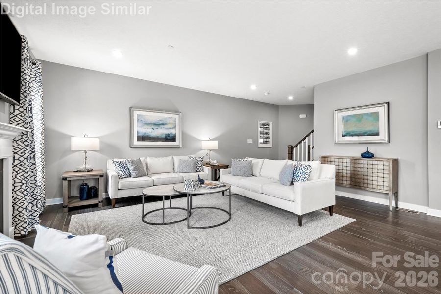 Spacious yet cozy great room with two oversized windows that pour in natural light. Seamlessly connected to the kitchen in an open floorplan—perfect for entertaining guests or curling up with a good book.