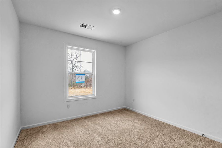 This cozy space features plush carpeting and a bri This cozy space features plush carpeting and a bri