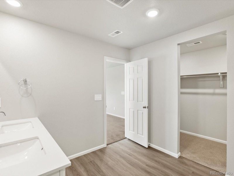 Primary bathroom walk in closet