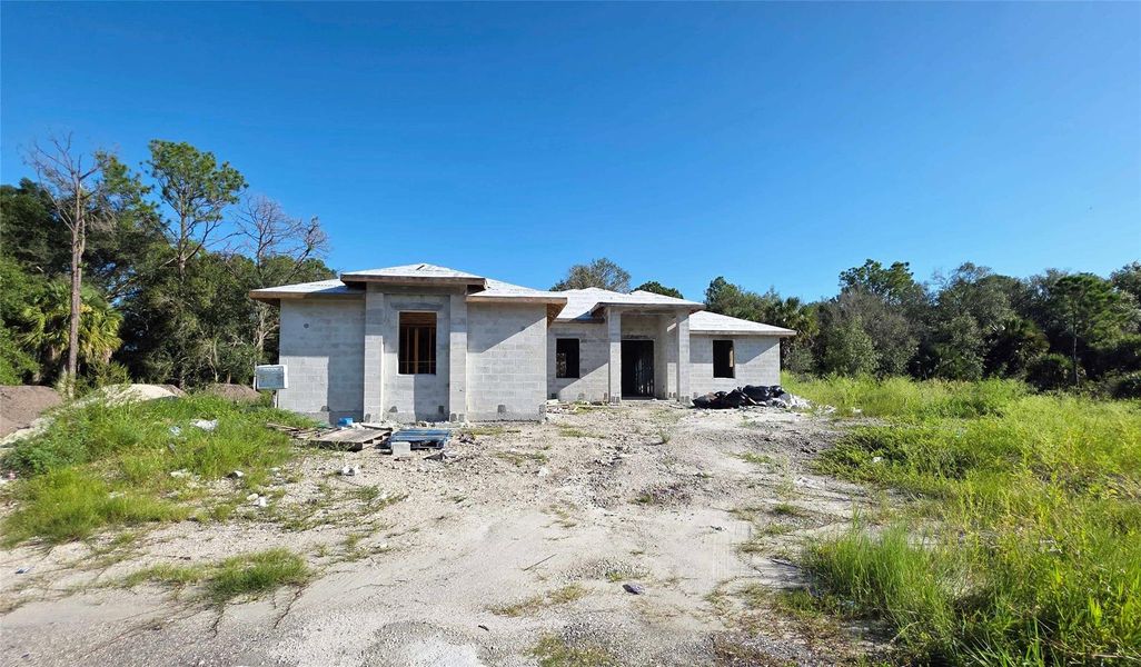 Front exterior of a new home in , Clewiston, FL, highlighting curb appeal (Image 7). Front exterior of a new home in , Clewiston, FL, highlighting curb appeal (Image 7).