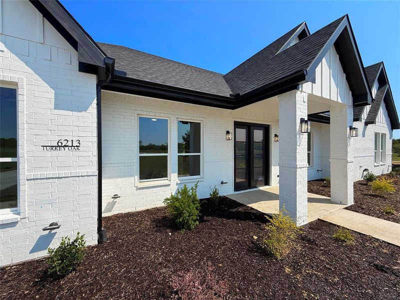 Front exterior of a new home in , Royse City, TX, highlighting curb appeal (Image 2). Front exterior of a new home in , Royse City, TX, highlighting curb appeal (Image 2).