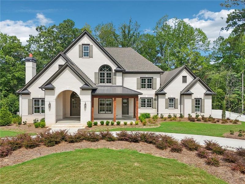 Front exterior of a new home in The Reserve At Governors Towne Club, Acworth, GA, highlighting curb appeal (Image 1). Front exterior of a new home in The Reserve At Governors Towne Club, Acworth, GA, highlighting curb appeal (Image 1).