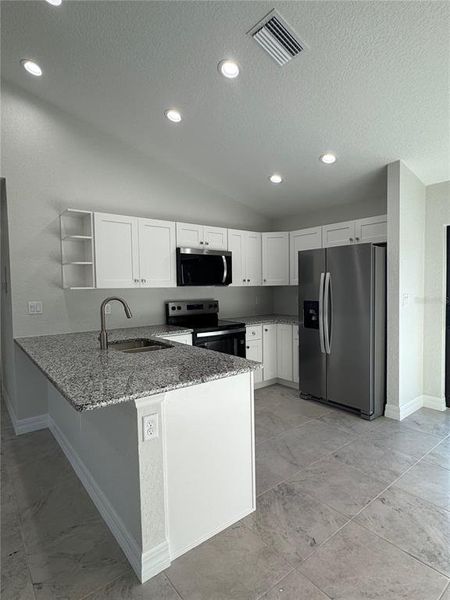 Furnished interior view inside a new home in , Port Charlotte (Image 9).