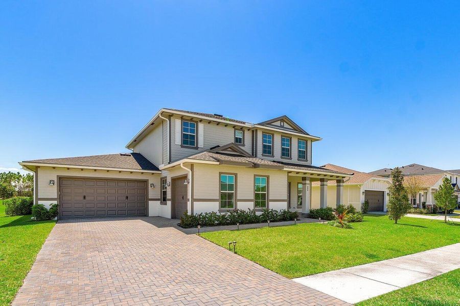 Front exterior of a new home in , Loxahatchee, FL, highlighting curb appeal (Image 25).