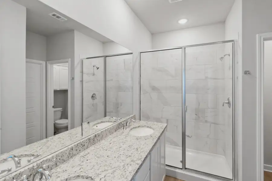 Representative furnished interior of a home built from the Duplex 1676 by TwoTen Communities in Amanda Park, San Antonio (Image 11).