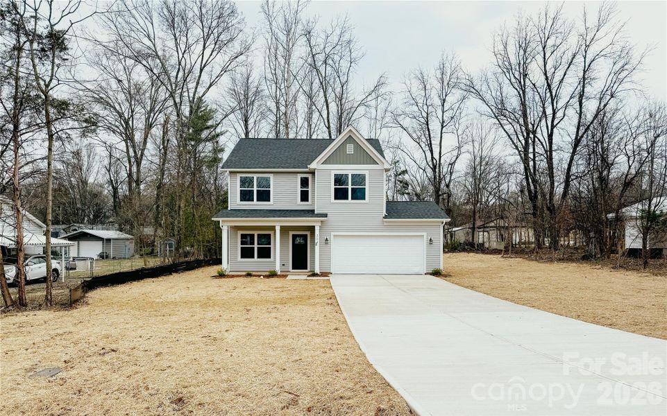 Front exterior of a new home in , Harrisburg, NC, highlighting curb appeal (Image 17).