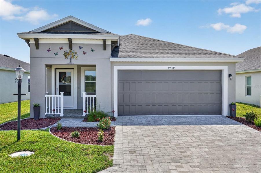 Front exterior of a new home in Cherrywood Preserve, Ocala, FL, highlighting curb appeal (Image 1). Front exterior of a new home in Cherrywood Preserve, Ocala, FL, highlighting curb appeal (Image 1).