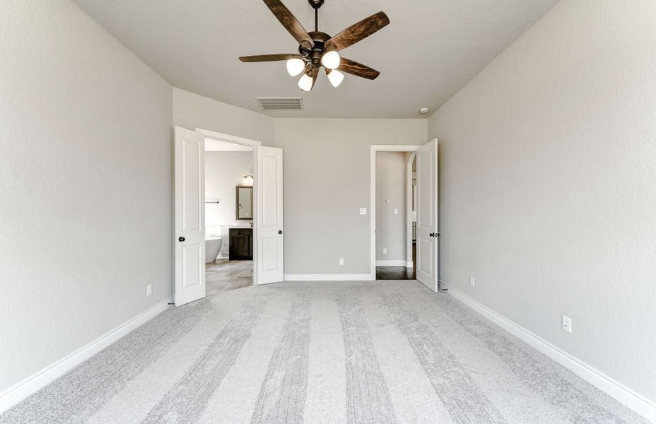 Representative unfurnished interior of a home built from the 3799 by Ravenna Homes in Artavia 70′, Conroe (Image 46).