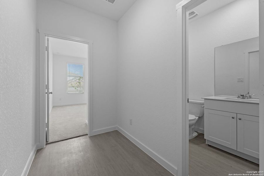 Spacious, unfurnished interior of a new home in Waterwheel: Coastline Collection, San Antonio (Image 17).