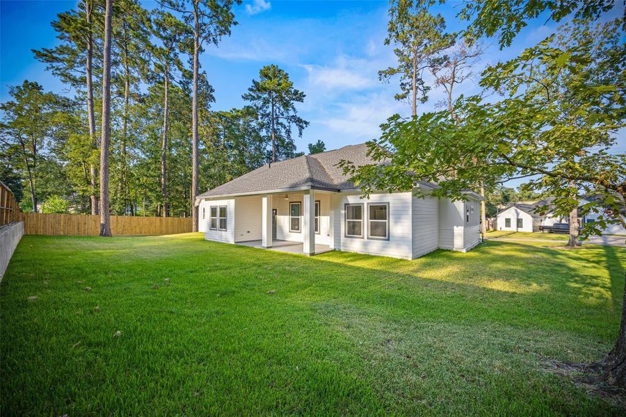 Front exterior of a new home in , Conroe, TX, highlighting curb appeal (Image 24).