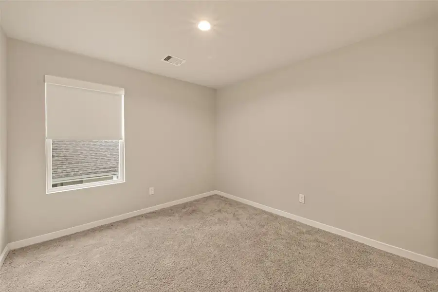 The final bedroom on the second floor is a versatile space that can be personalized as a guest room, home office, or hobby area to fit your needs.