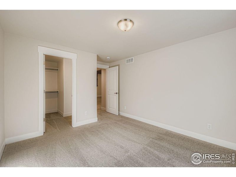 Spacious, unfurnished interior of a new home in RainDance National 60/70, Windsor (Image 22).