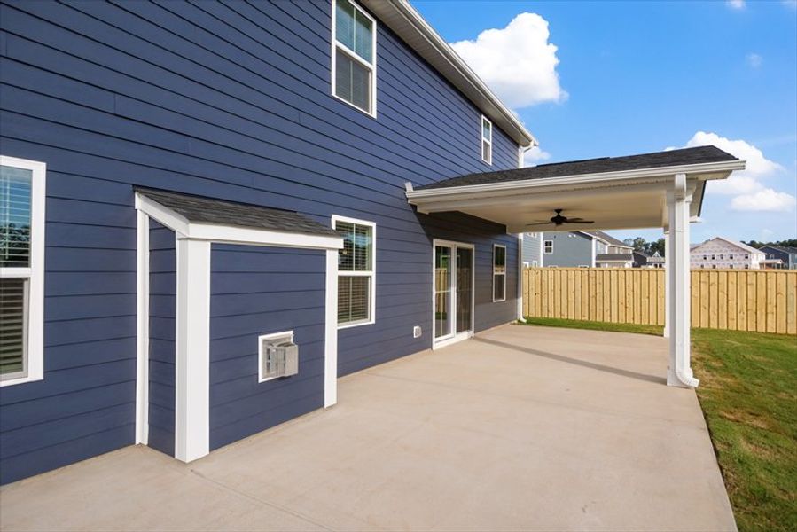 Exterior details and patio area of a home in Canterbrook Farms 2-Story, Fountain Inn (Image 17).
