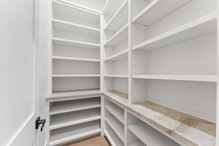 Large walk-in pantry provides ample storage. Large walk-in pantry provides ample storage.