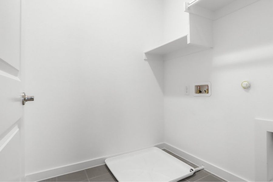 Spacious, unfurnished interior of a new home in The Tribute, The Colony (Image 18).